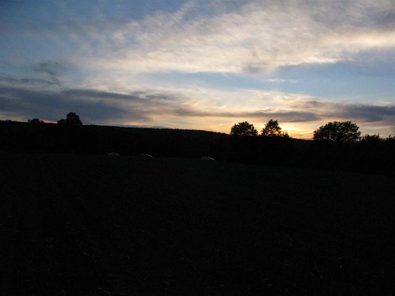 Sunset & cars on the ridge watching us